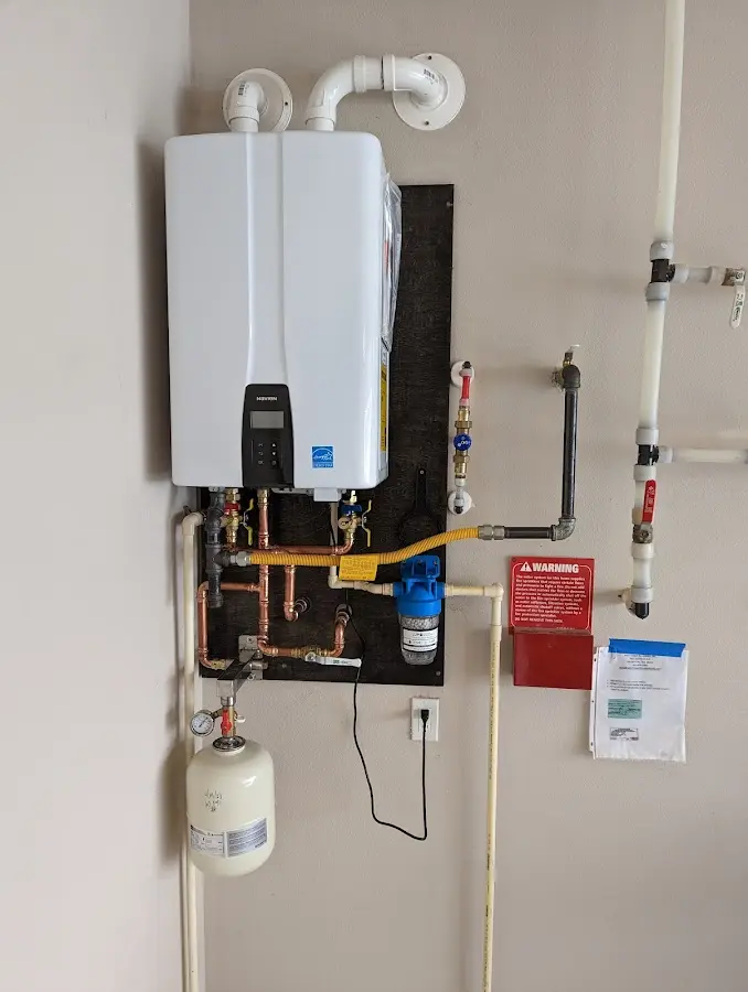 Professional plumber installing copper piping in a Morgan City home